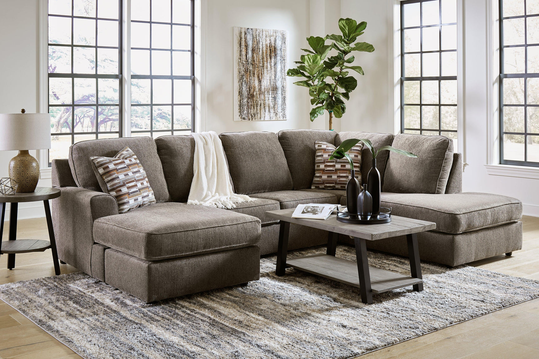 Living room view featuring O'phannon Putty 2-Piece Sectional Sofa with Chaise