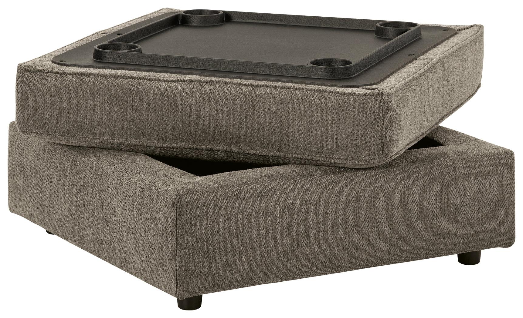 Ottoman underside showing built-in tabletop and cup holders