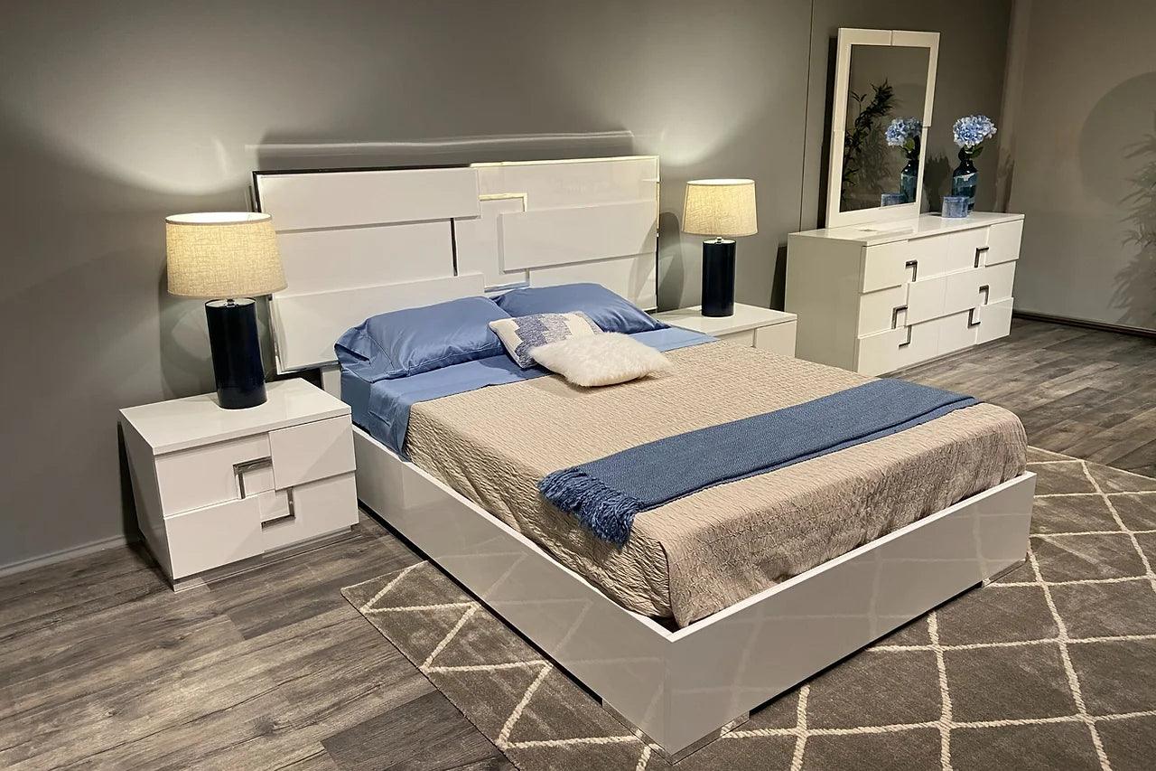 Infinity White Panel Bedroom Set bed angled bedroom view