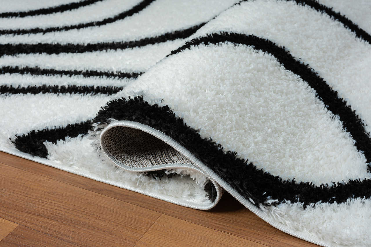 Close-up of ivory shag texture on area rug