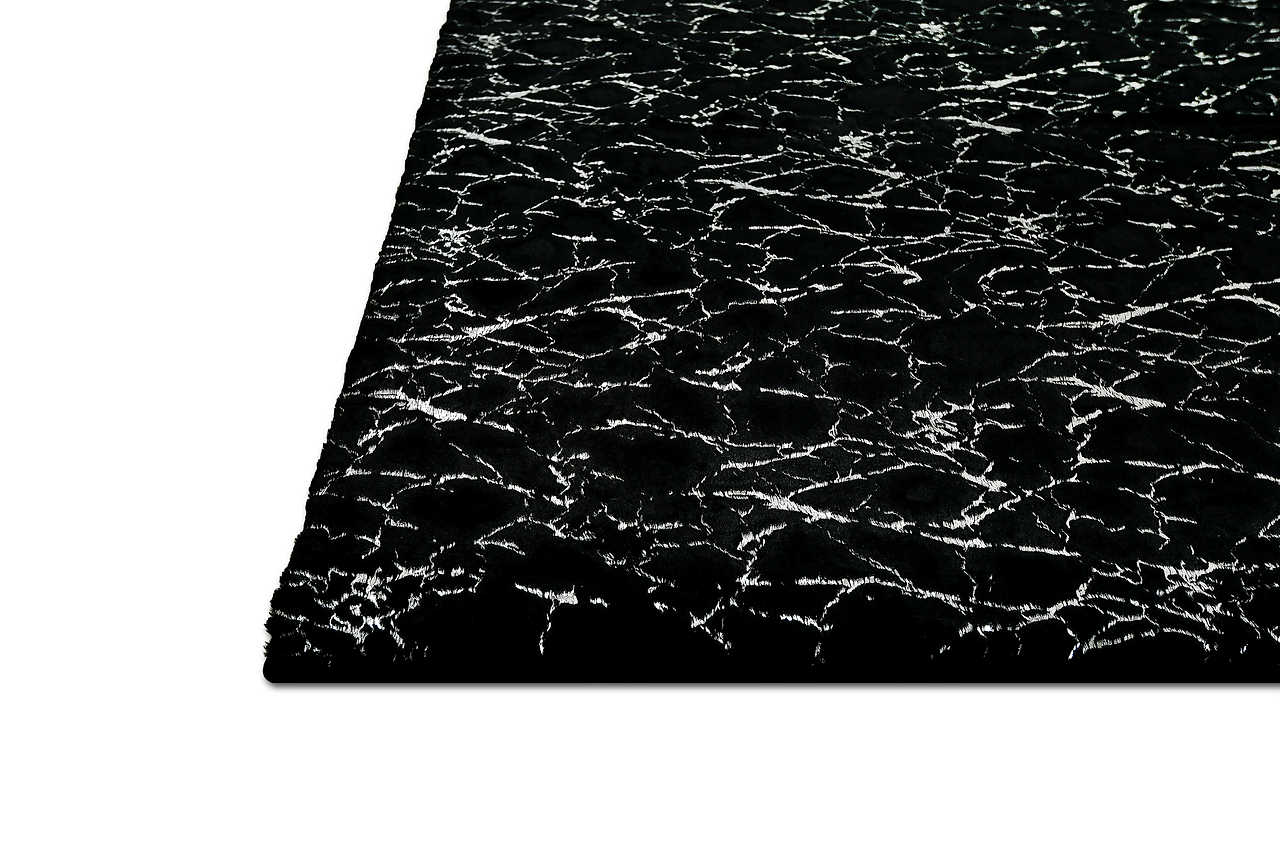 Decorative styling of Rabbit Black and Silver rug in room setting