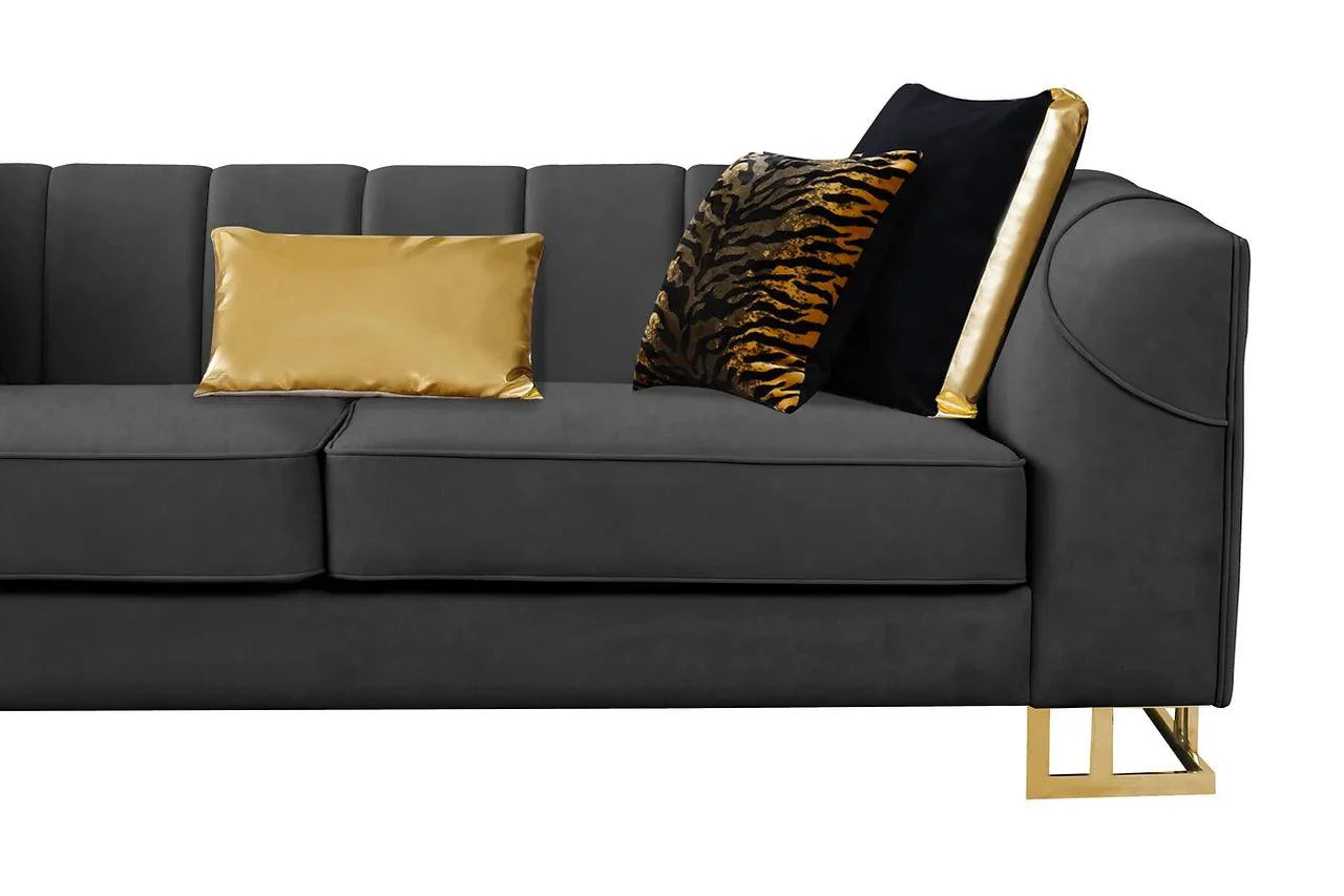 Front angle of black velvet sofa with gold accents