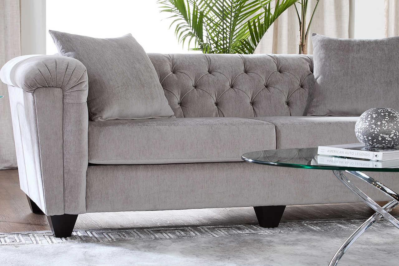 Lush Silver Velvet Upholstered Tufted Sofa angled front view