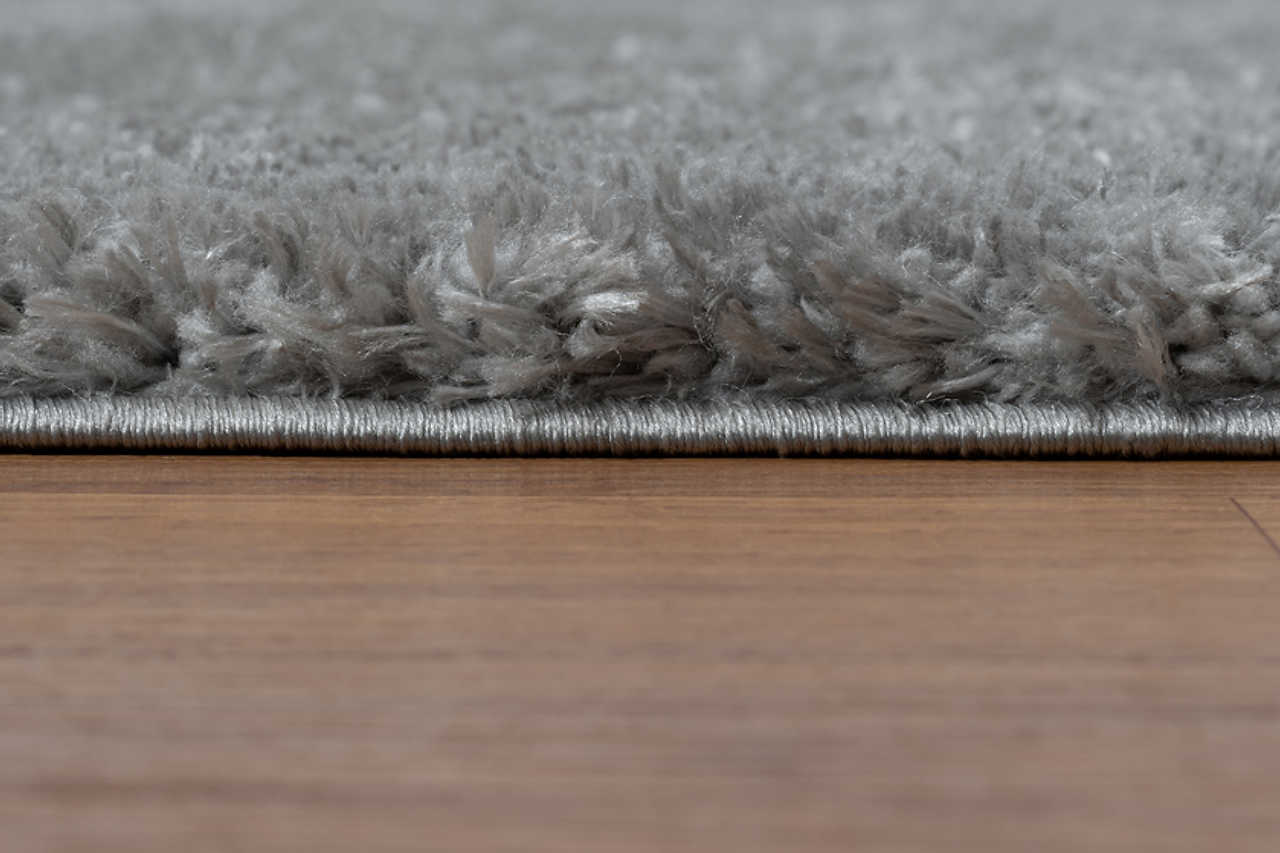Comfy Shag Carbon rug displayed in living room