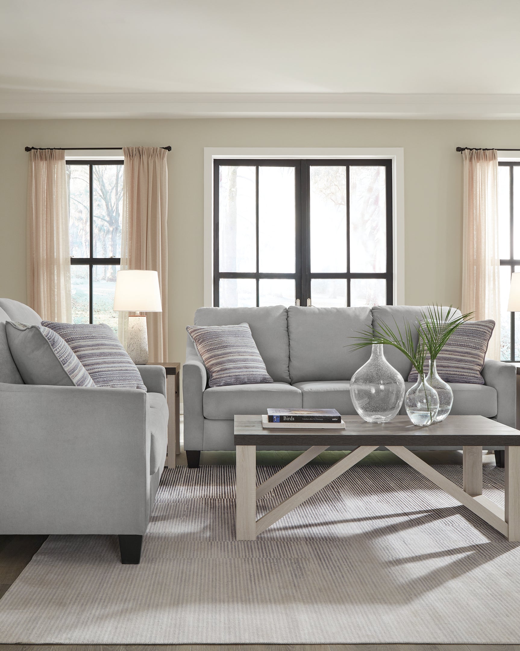 Adlai Shadow Sofa and Loveseat set styled in living room, main view