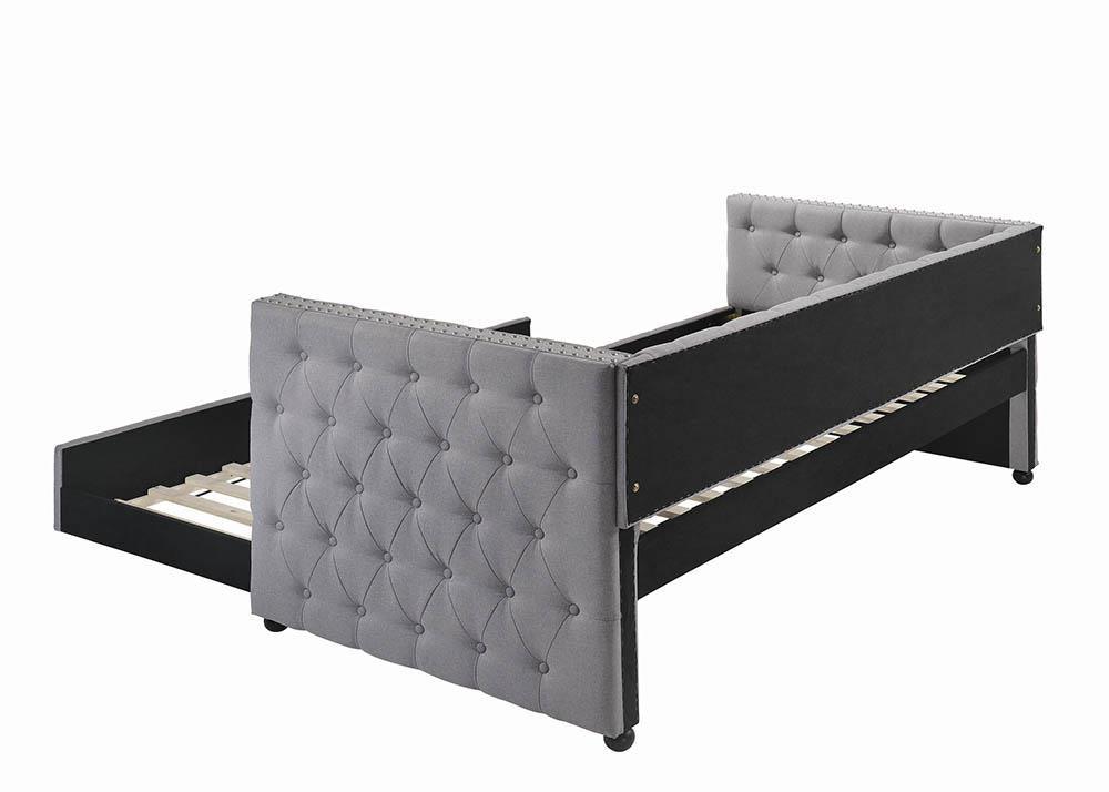 Angle showing tufted mattress and daybed frame in grey