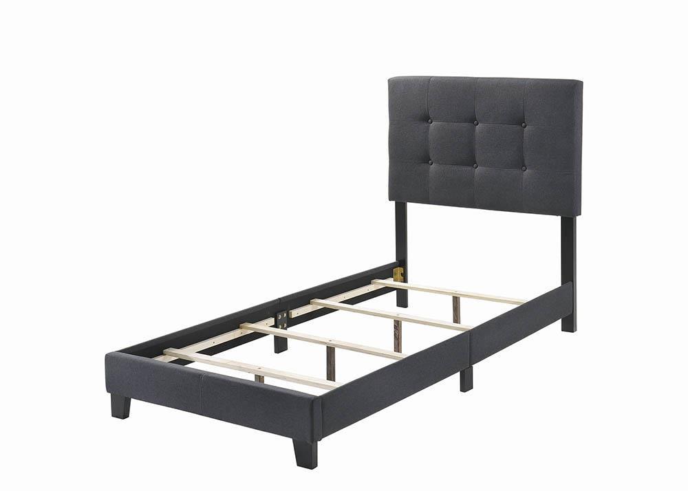 Close-up of tufted fabric headboard on Mapes Twin Bed