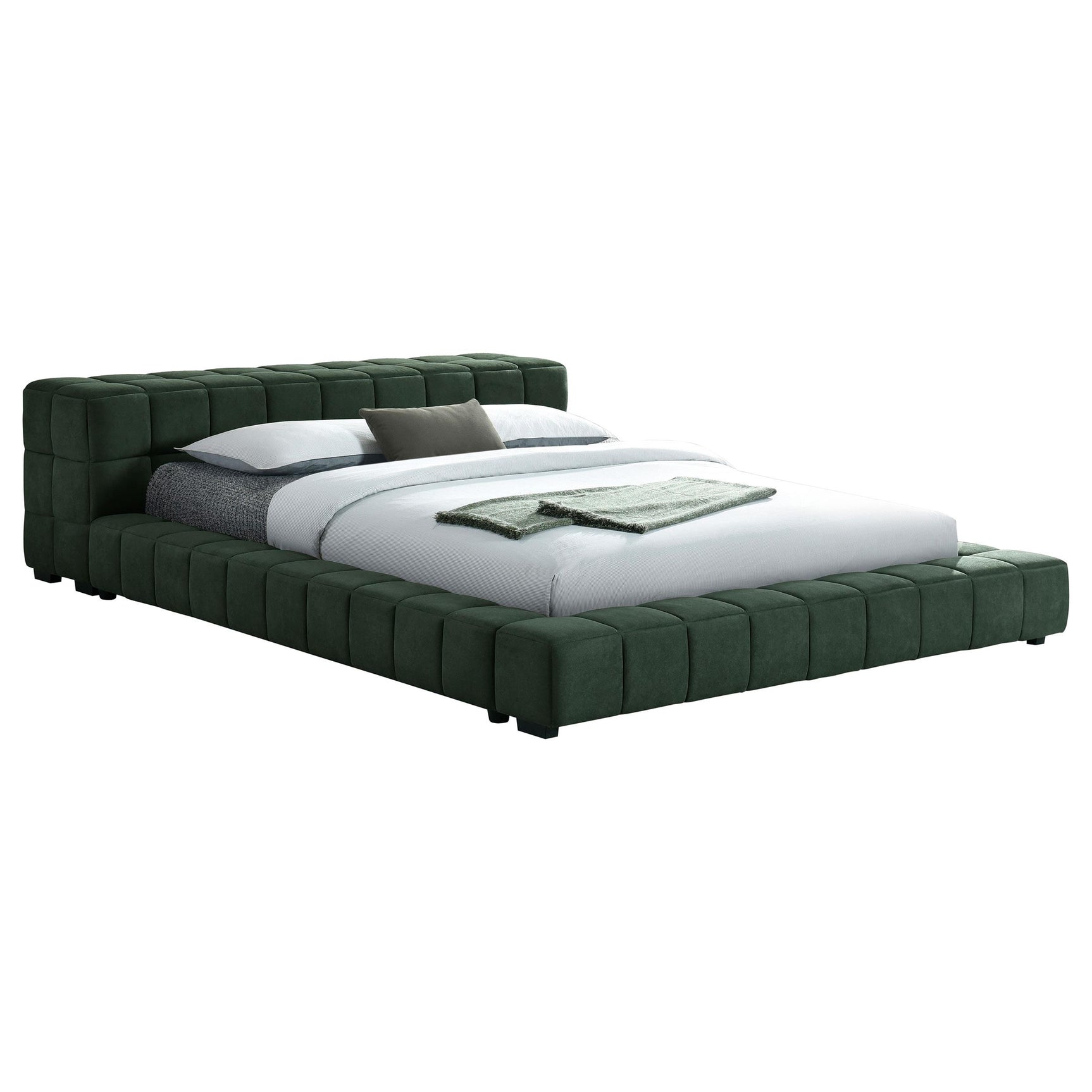 Close-up of tufted green fabric headboard