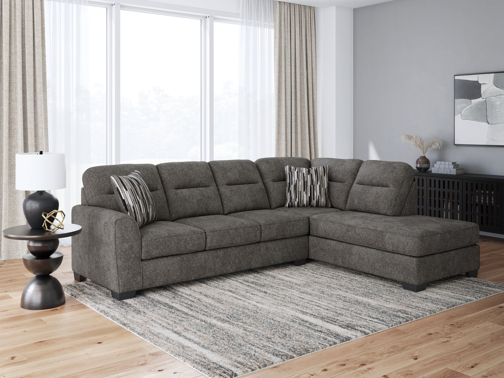 side angle showing chaise on Olten Graphite sectional sofa