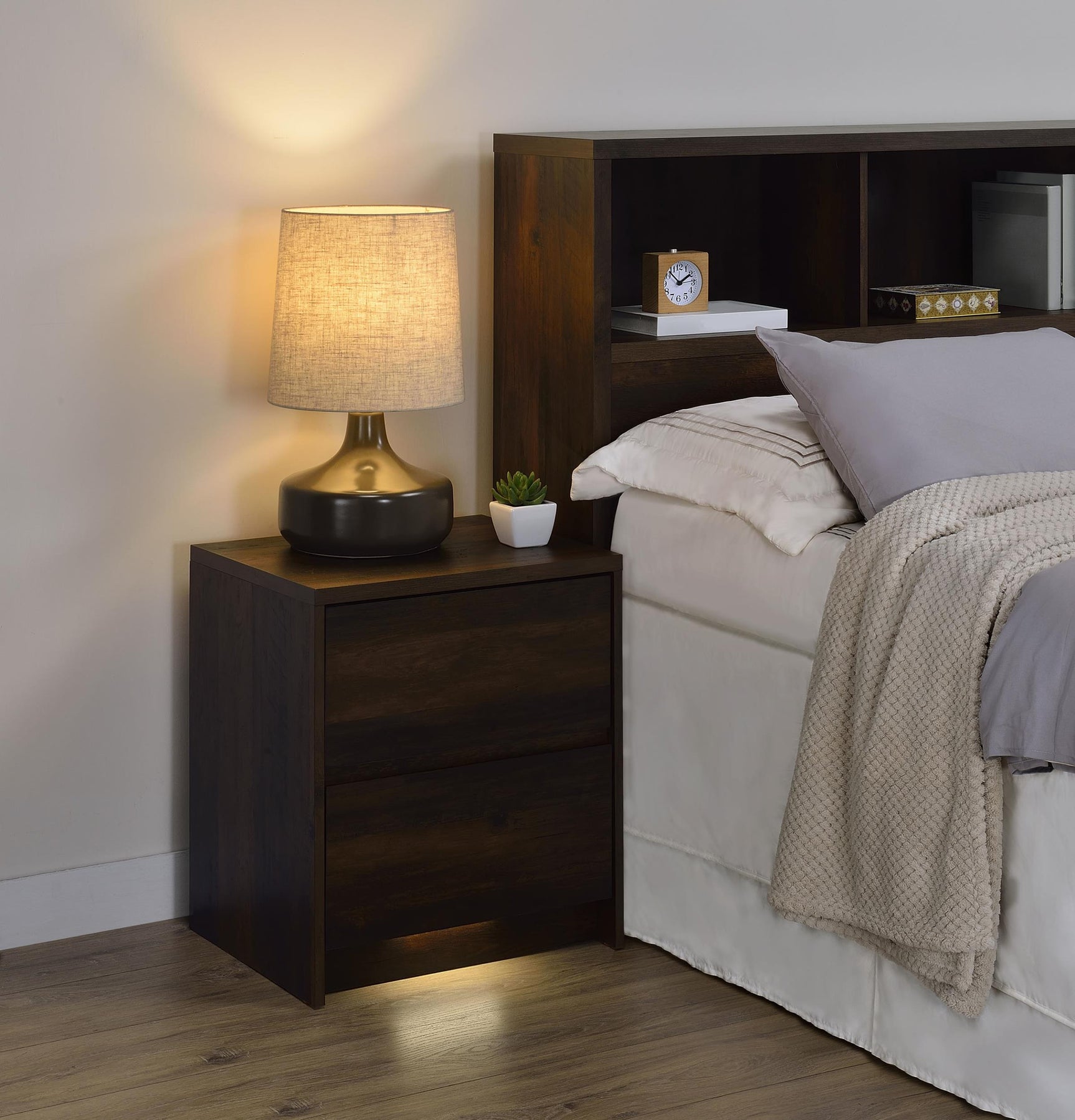 Side angle of Westpark nightstand highlighting dark pine finish