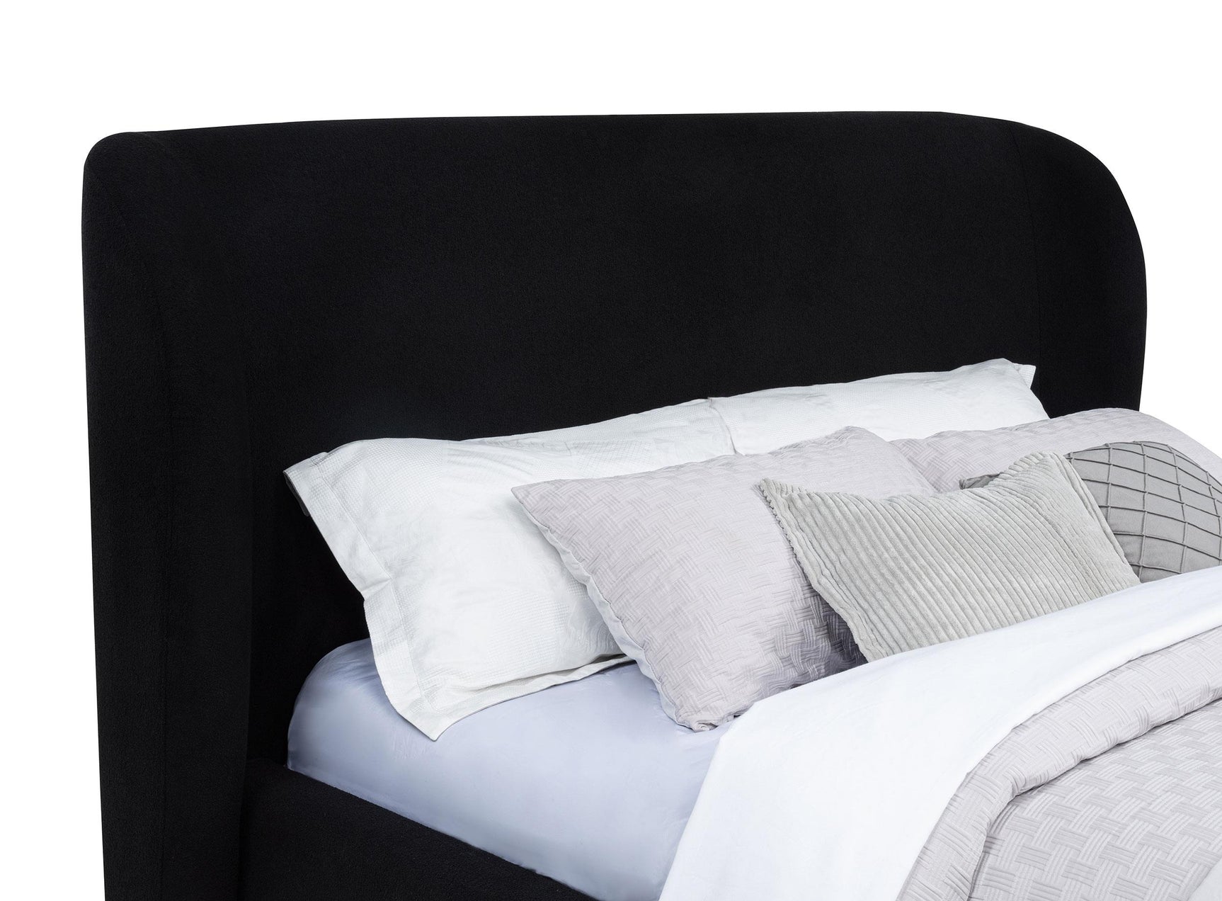 Blaire Eastern King wingback upholstered bed black side angle showing base