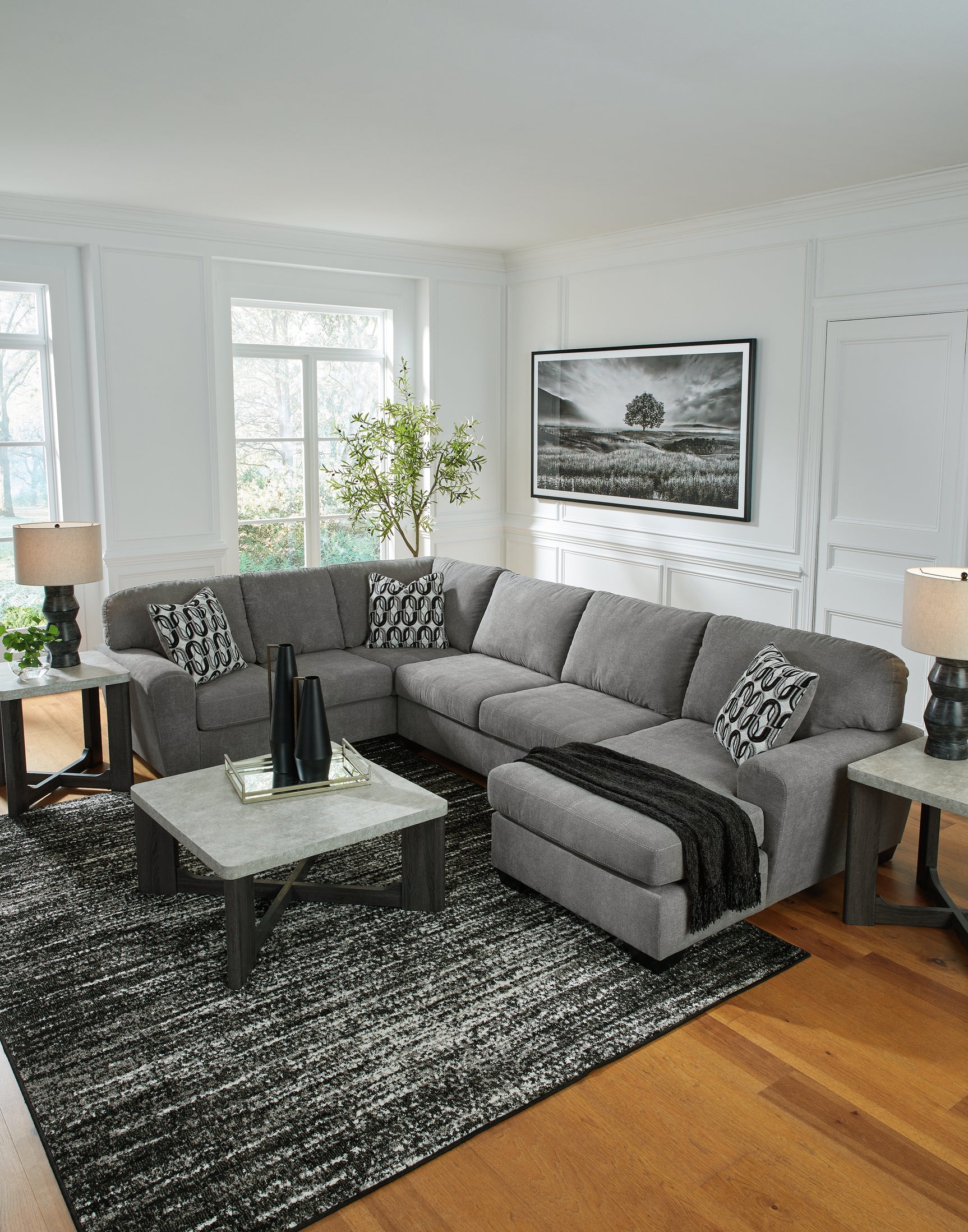 Close-up detail of gray chenille fabric on sectional sofa