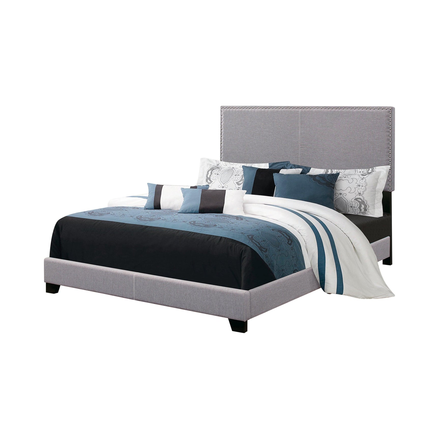 Boyd Queen Upholstered Bed side angle highlighting black solid wood legs and chrome nailhead detailing