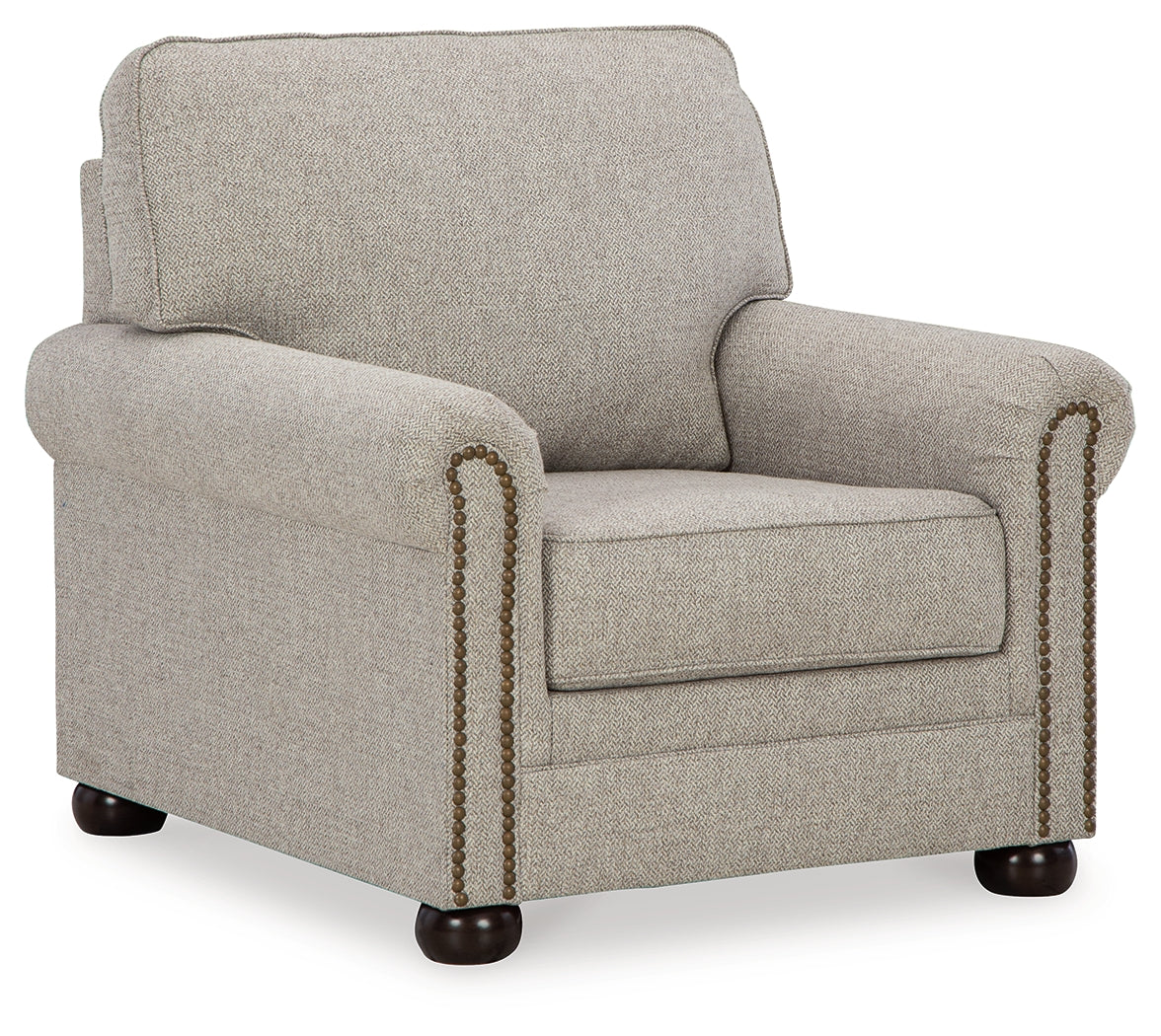 Gaelon chair side angle showing bun legs and upholstery