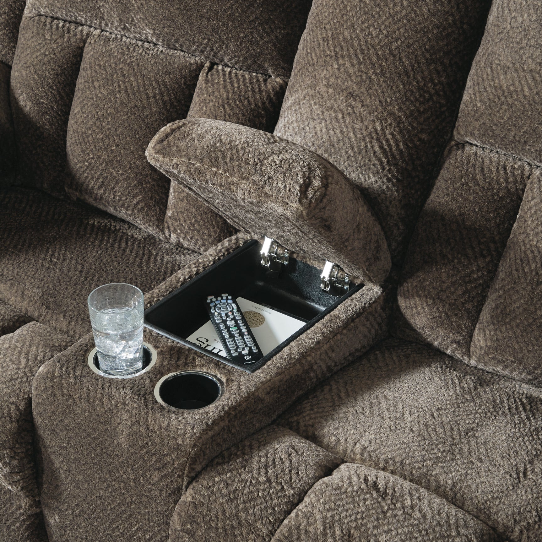 Close-up of center console storage and cup holders