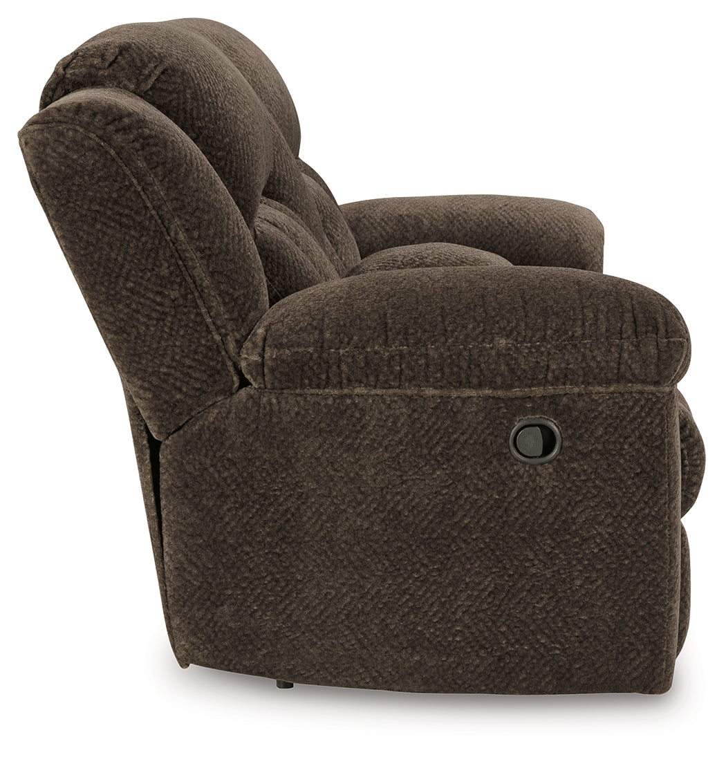 Side view showing pull-tab reclining mechanism