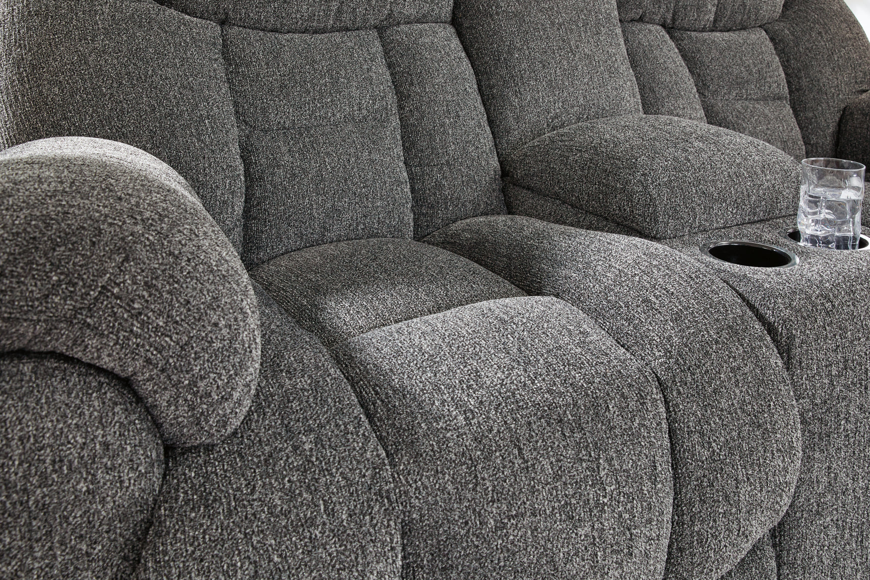 Tufted detailing close-up on loveseat seat cushion