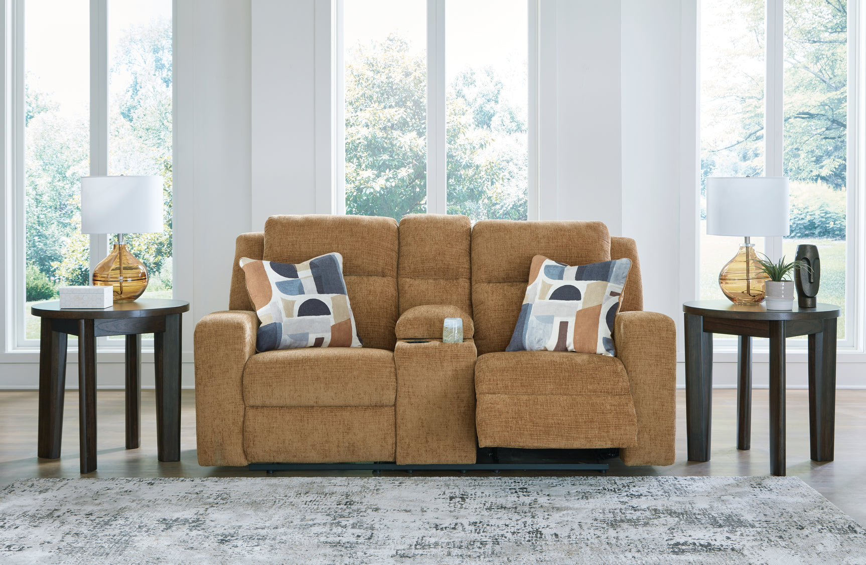 Console storage open with loveseat armrest visible