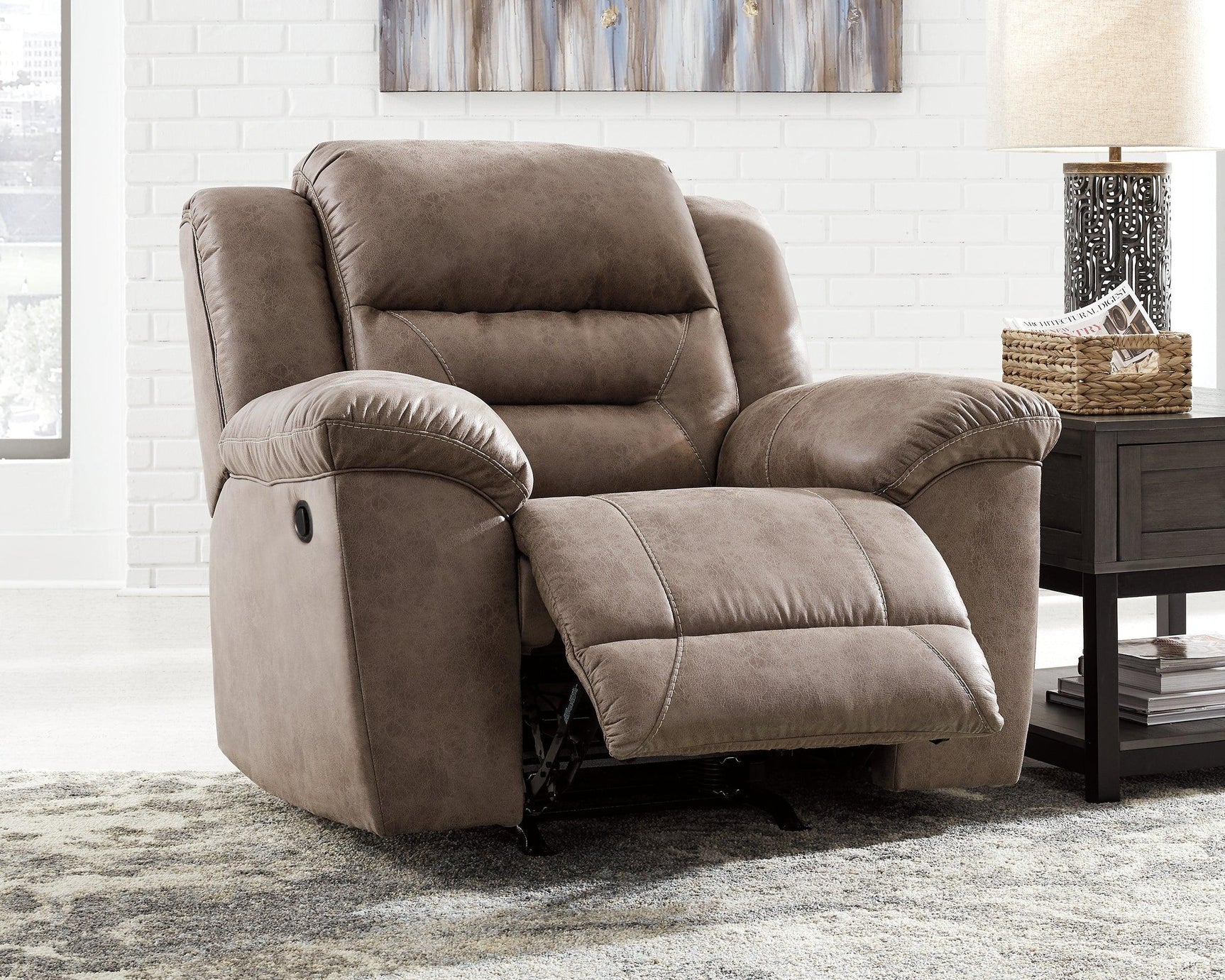 Reclining angle showing features of Stoneland Chocolate Faux Leather Recliner
