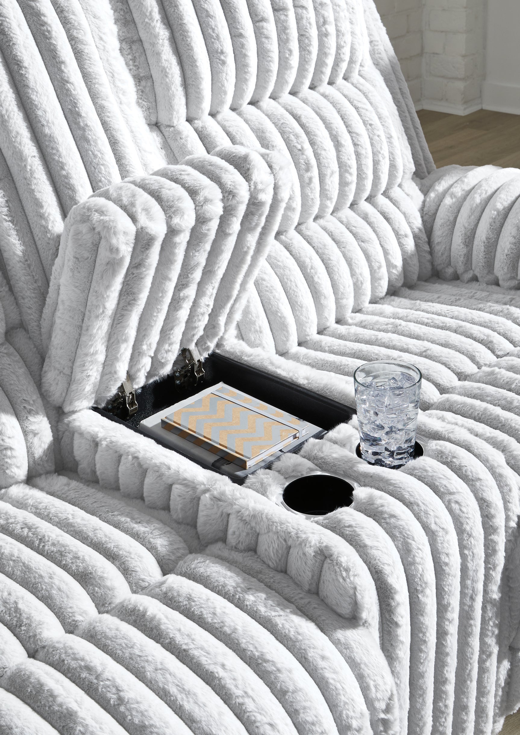 Close-up of center console with cup holders and hidden storage