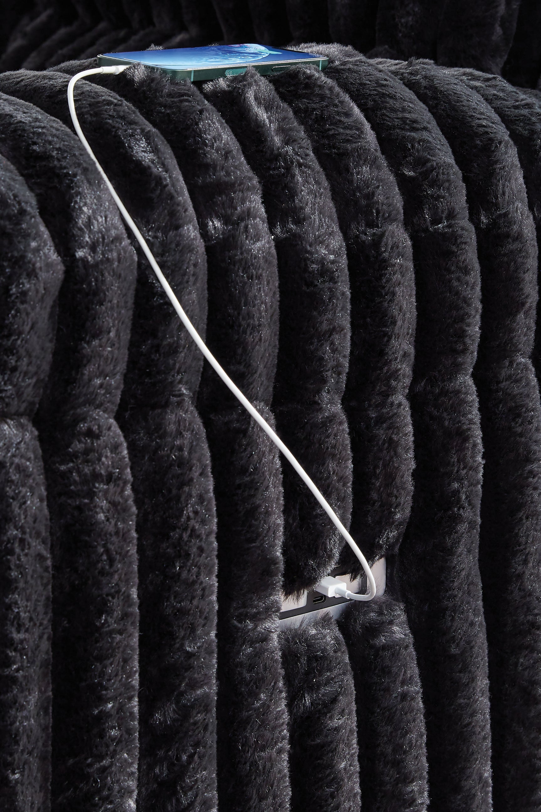 Detail of power cord and zero-draw USB port on loveseat