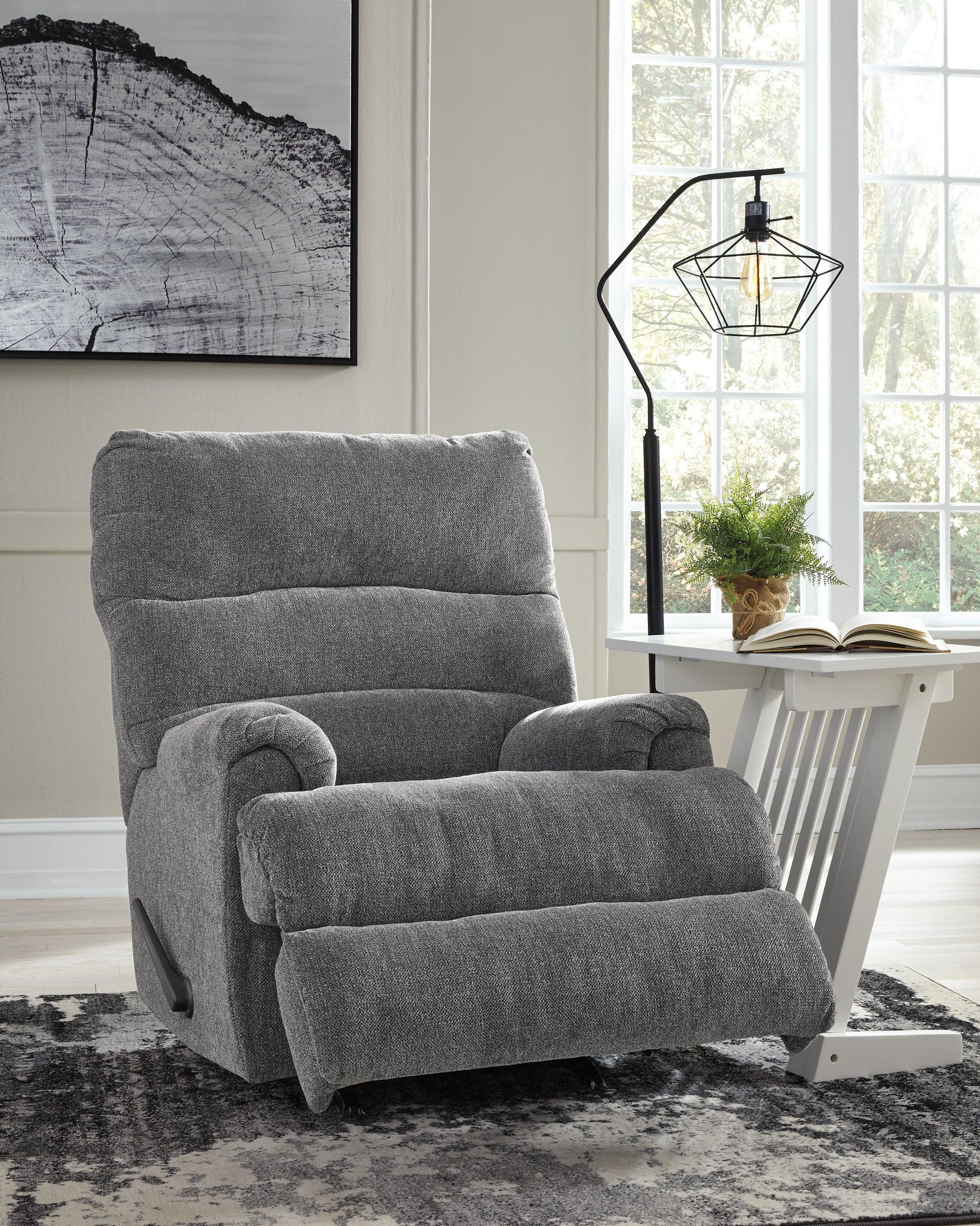 side view of Man Fort Graphite Chenille Recliner with footrest extended
