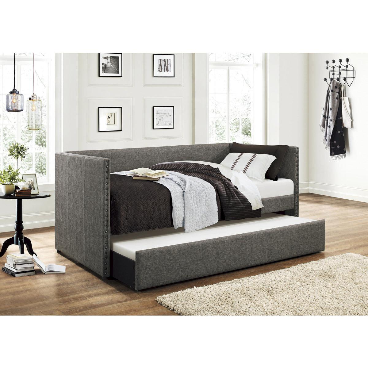 Open trundle bed under Therese daybed