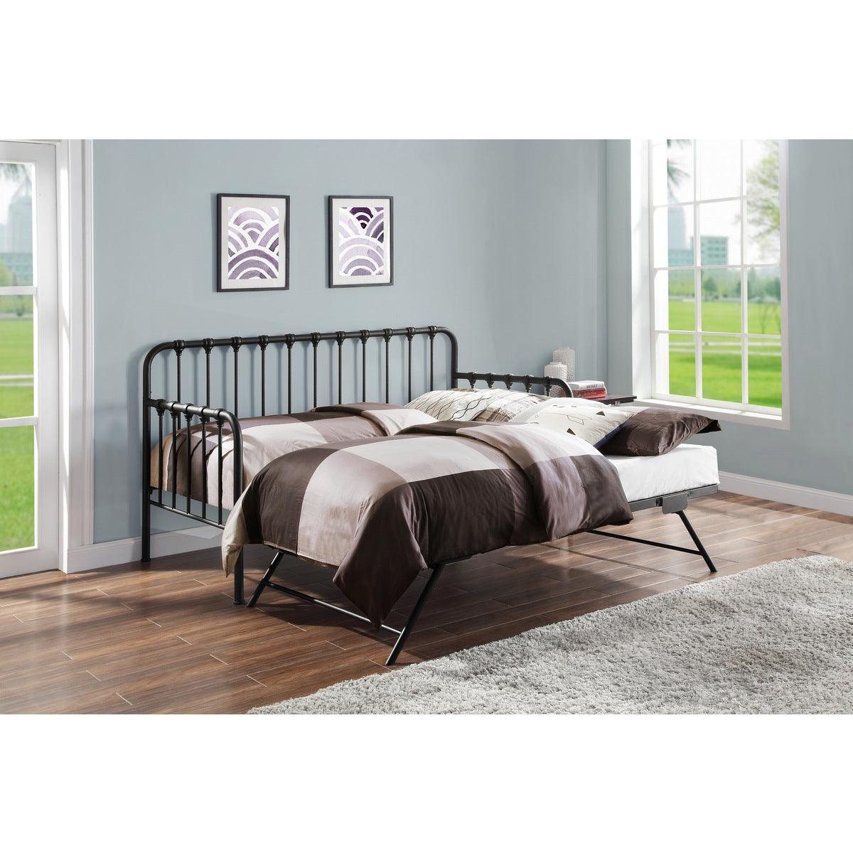 Top angle showing open lift-up trundle under black metal daybed