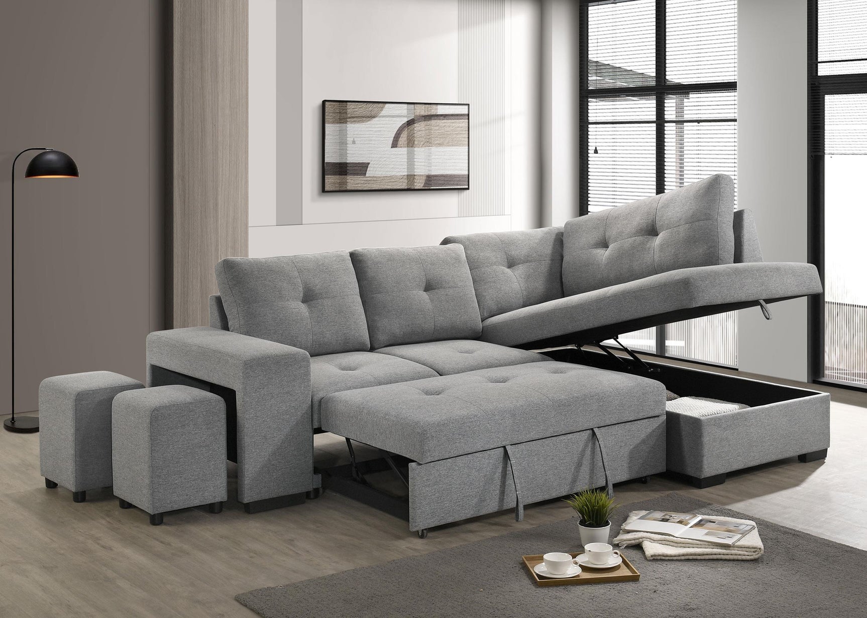 Two upholstered stools nested inside armrest of sectional sofa