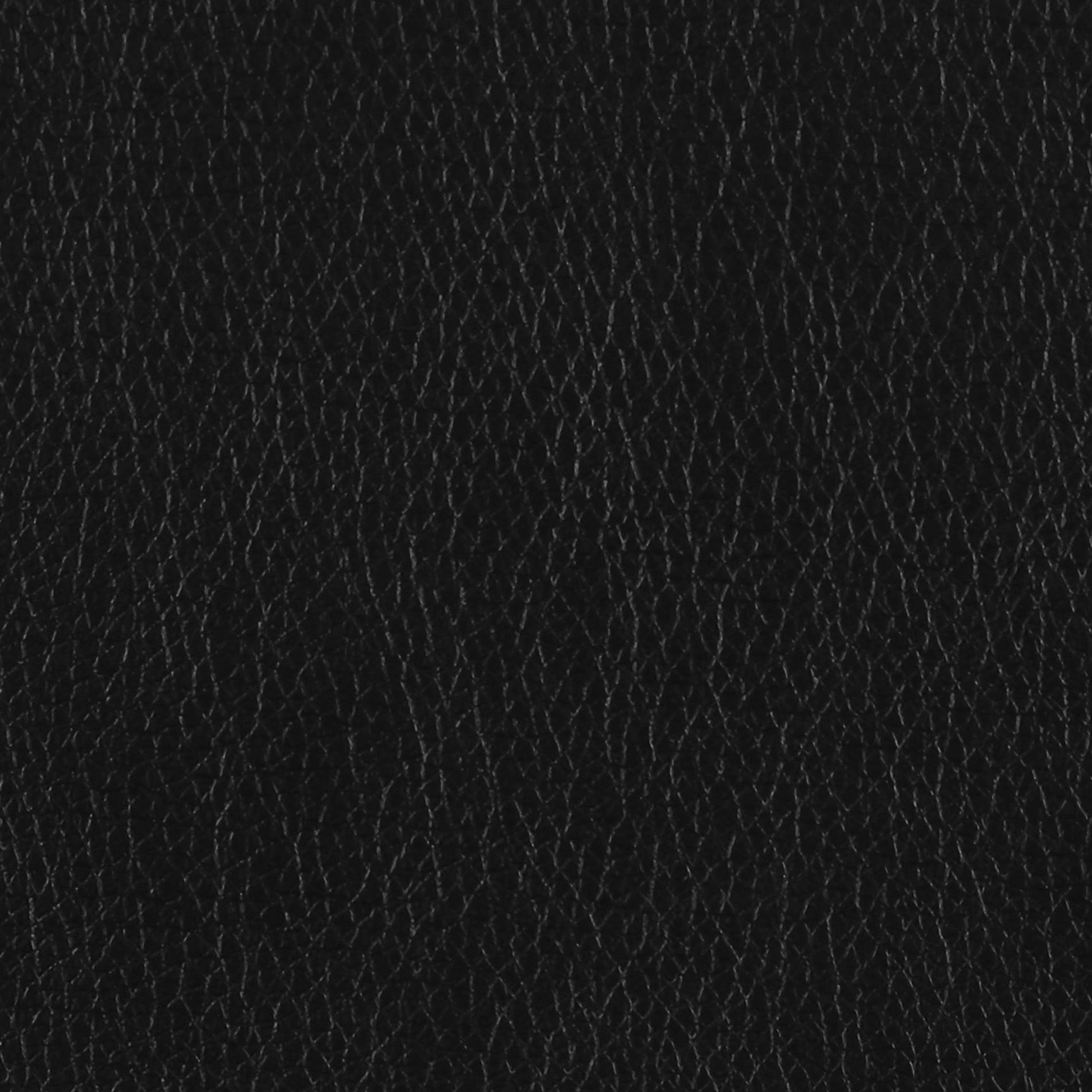Finley black tufted upholstered sofa close front angle