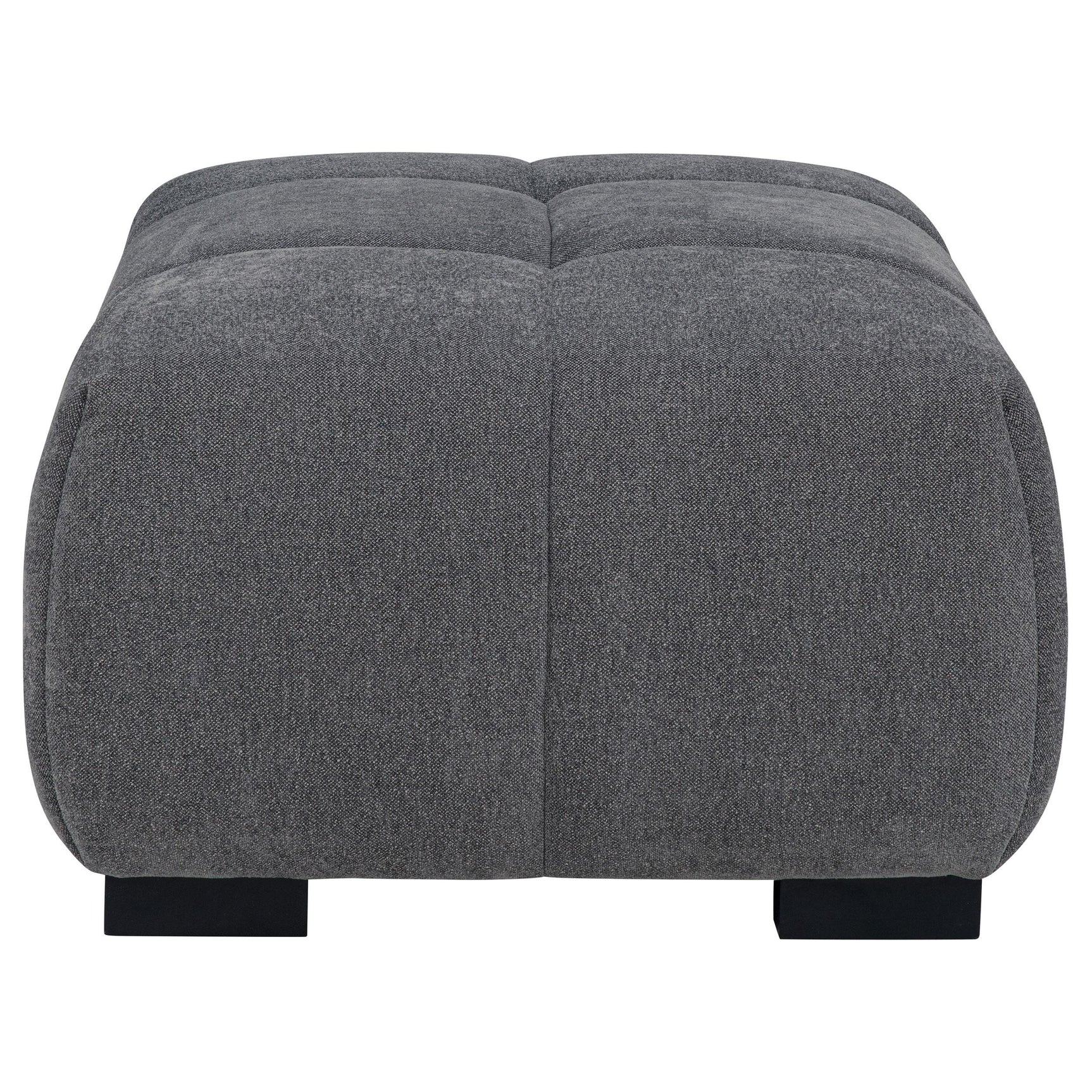 Octavia Ottoman showing sturdy wooden legs and texture