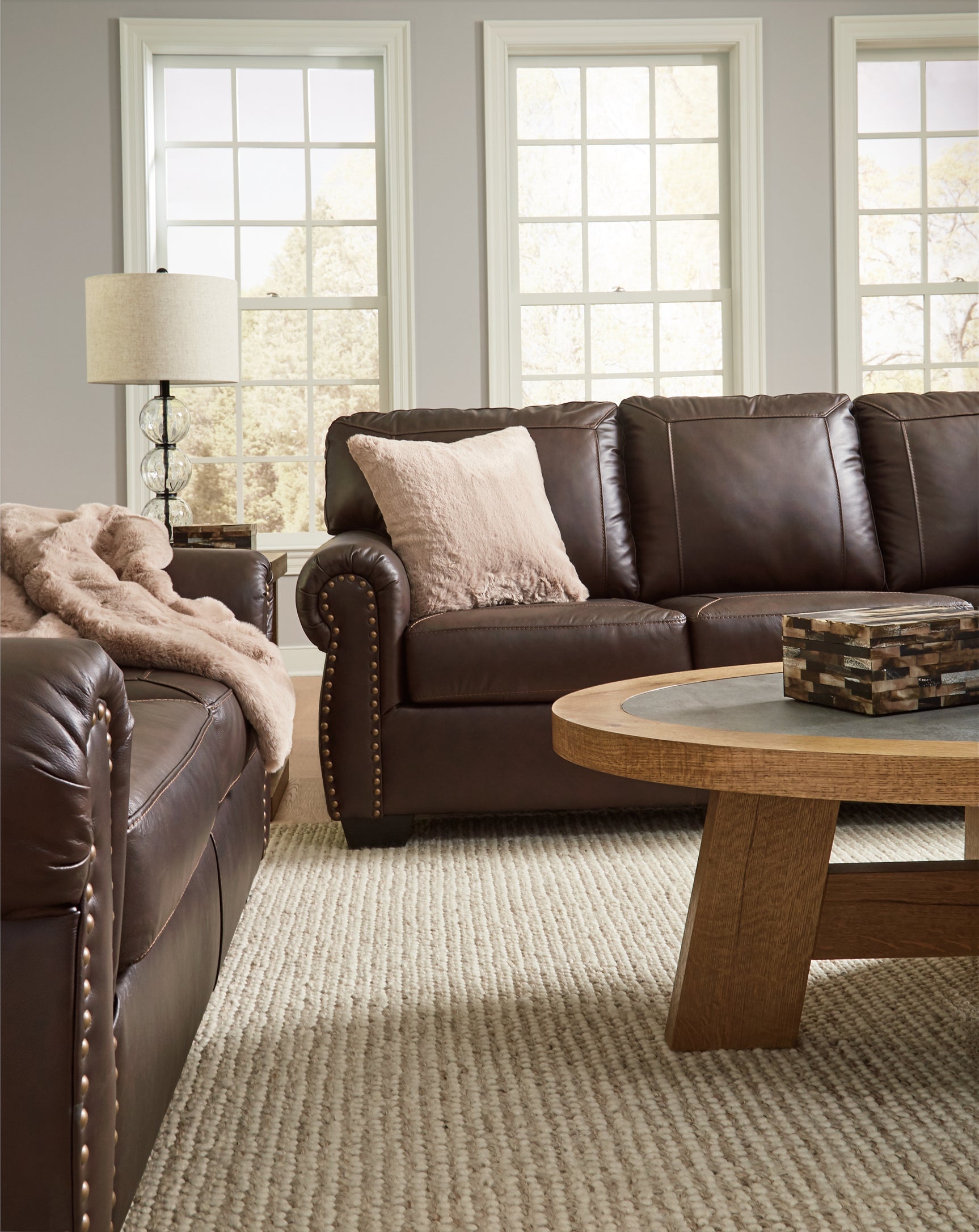 Detail of Colleton dark brown sofa and loveseat armrest