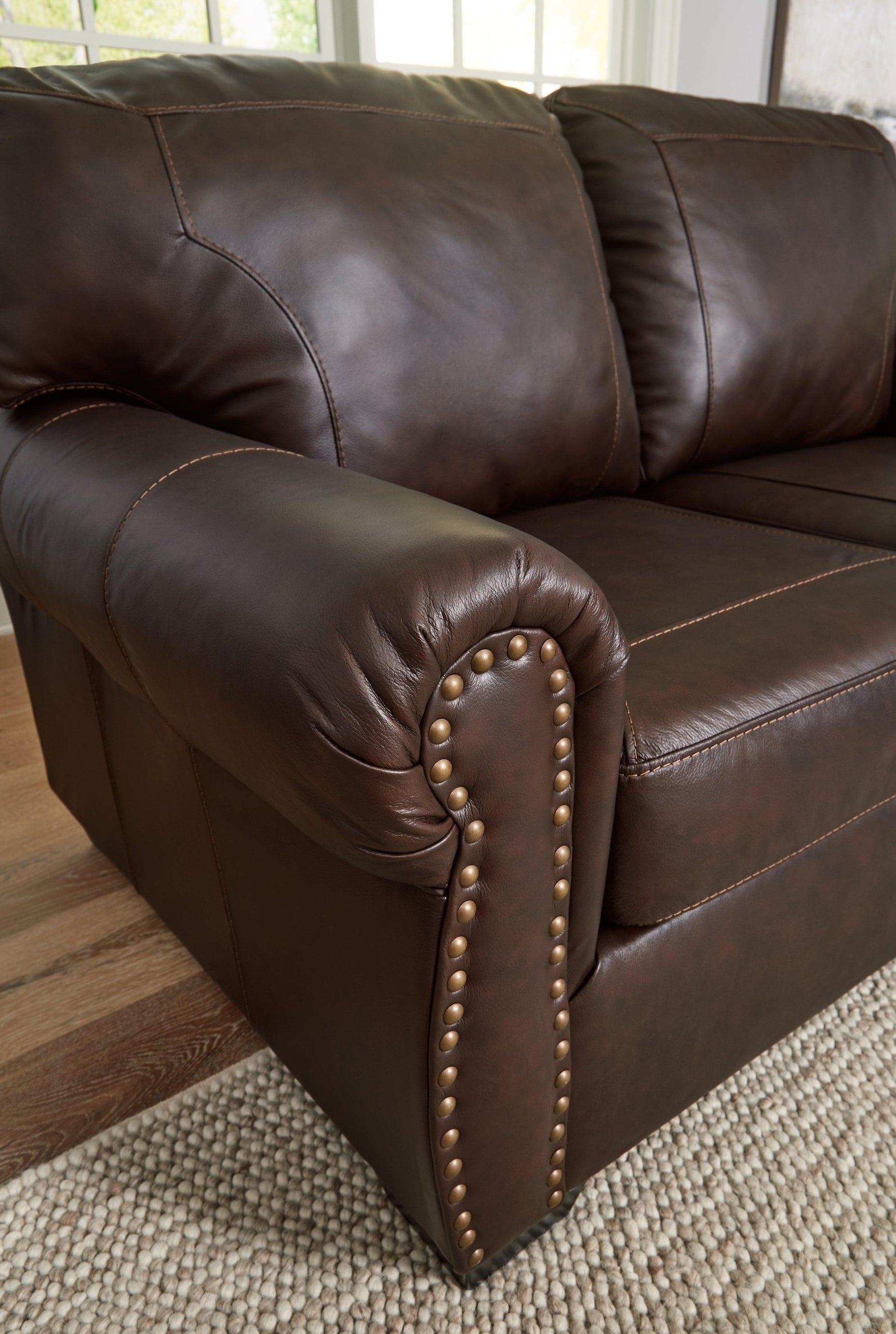Close-up of nailhead trim on Colleton loveseat arm