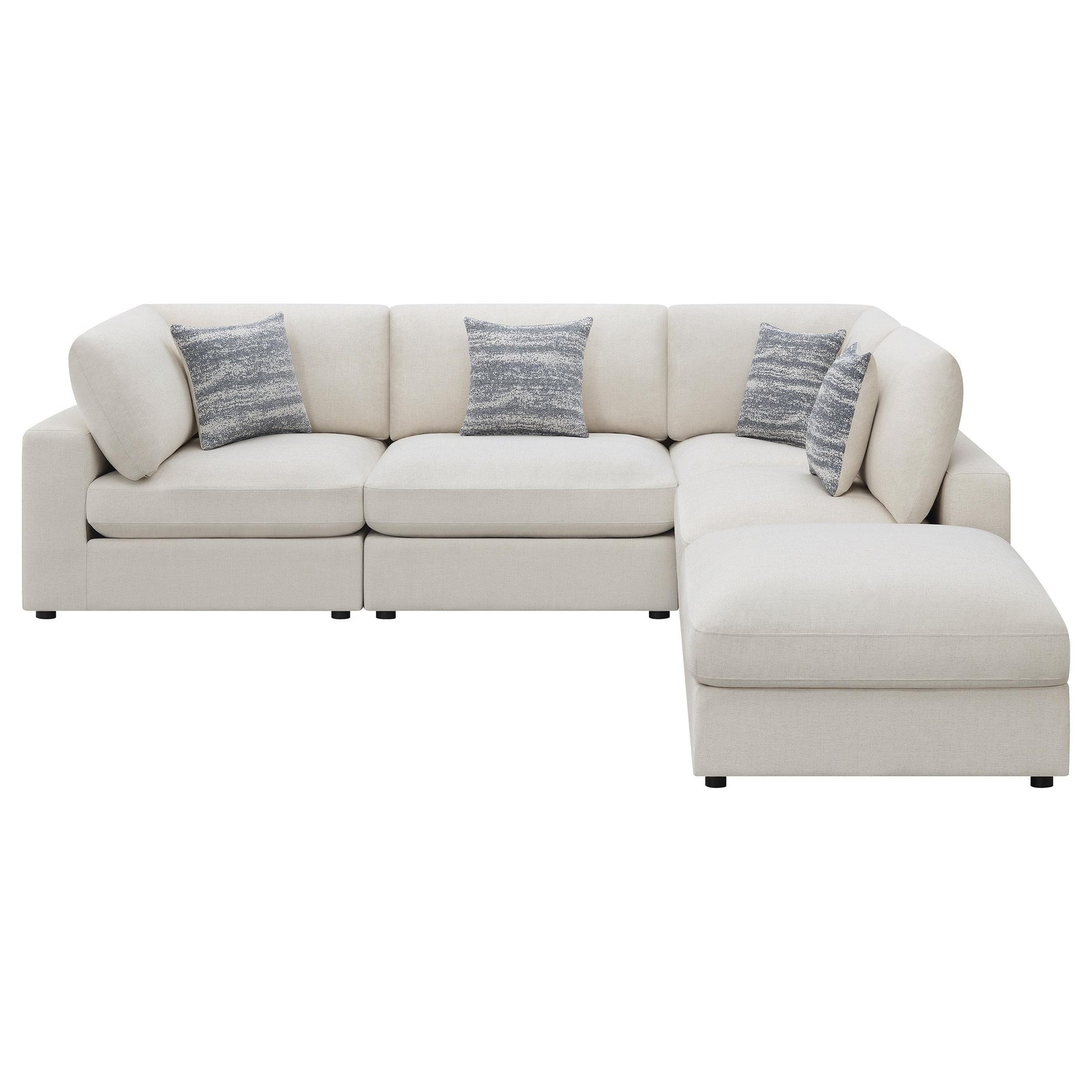 Detail view of beige fabric upholstery and foam cushions on Serene sectional