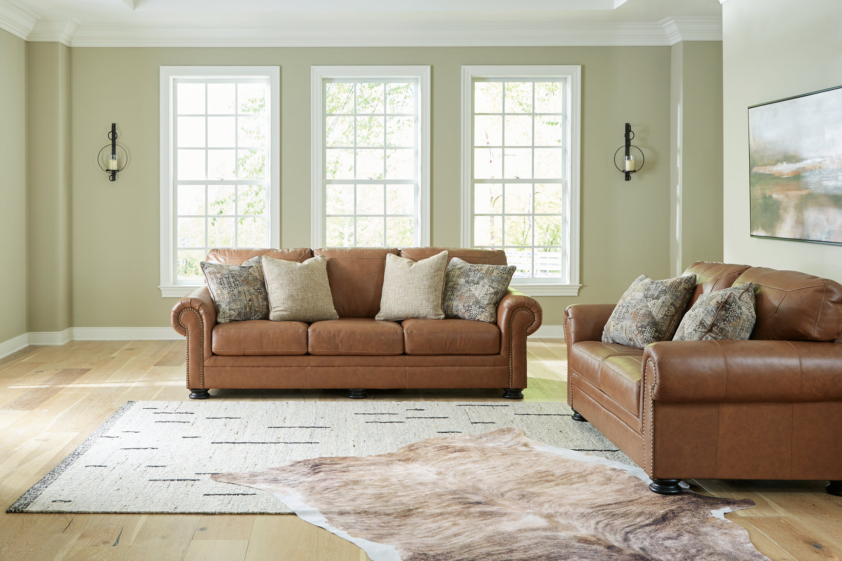 Side view of Carianna Caramel Sofa and Loveseat furniture