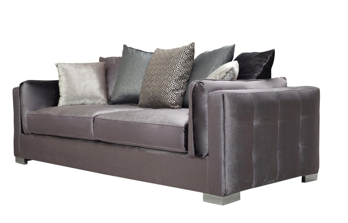 Detailed view of corner and cushions on gray velvet sofa and loveseat