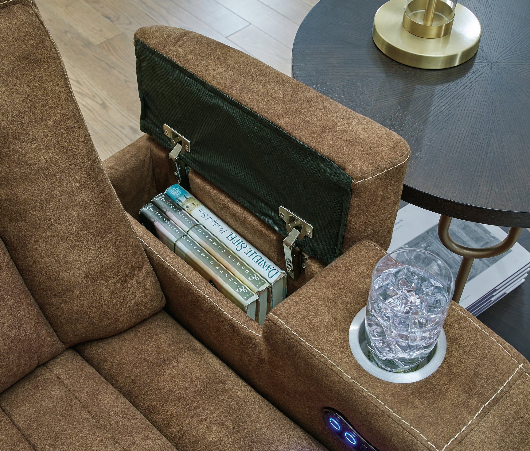 Armrest storage compartment with remote controls