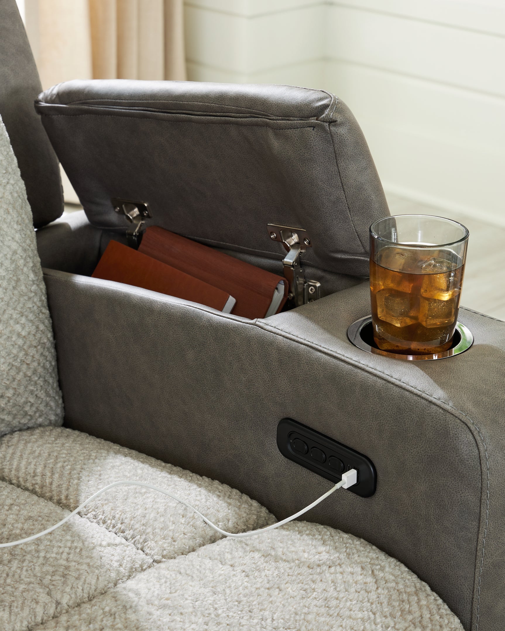 Power USB ports and cup holders on WhipLash sofa storage armrest