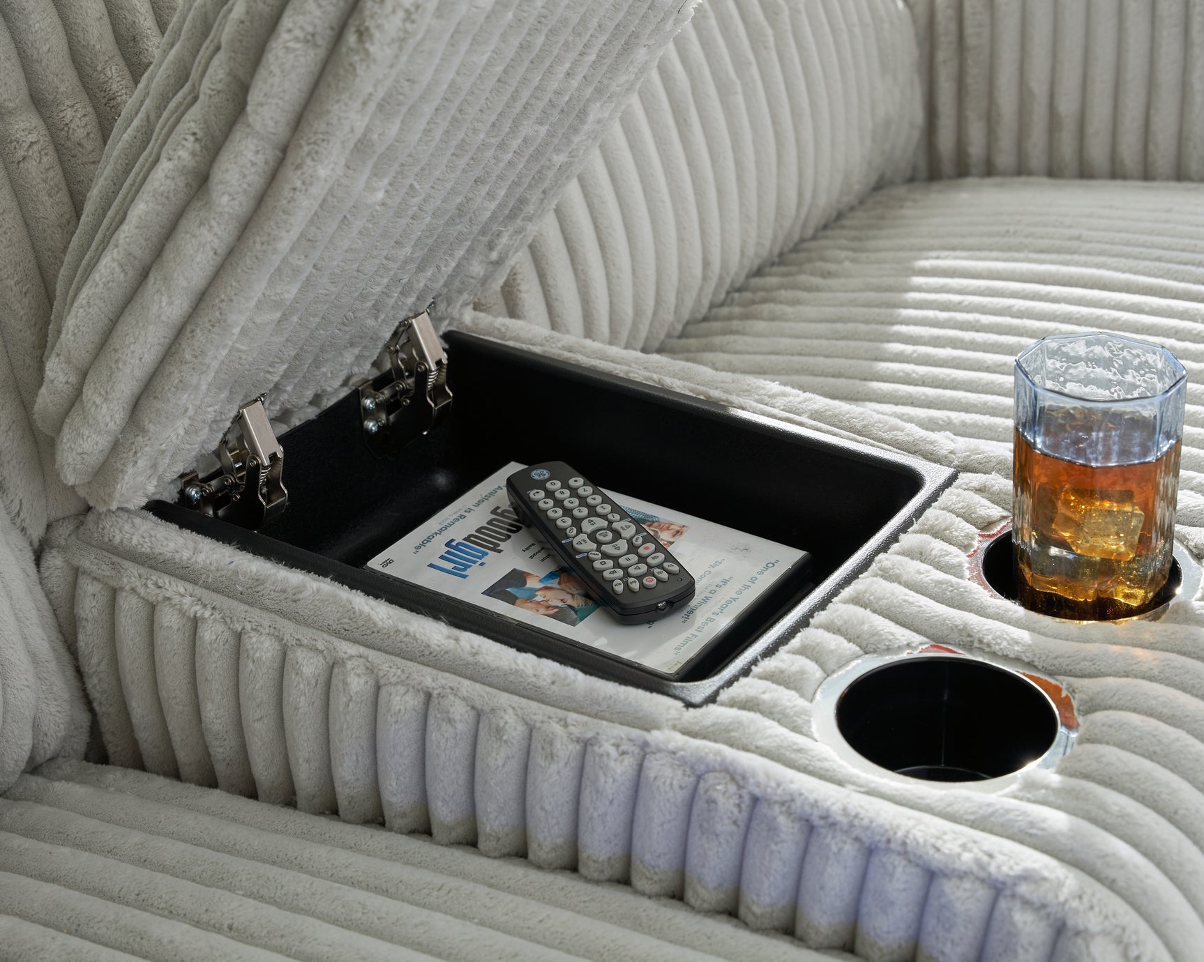 Storage cutout and cup holders on loveseat