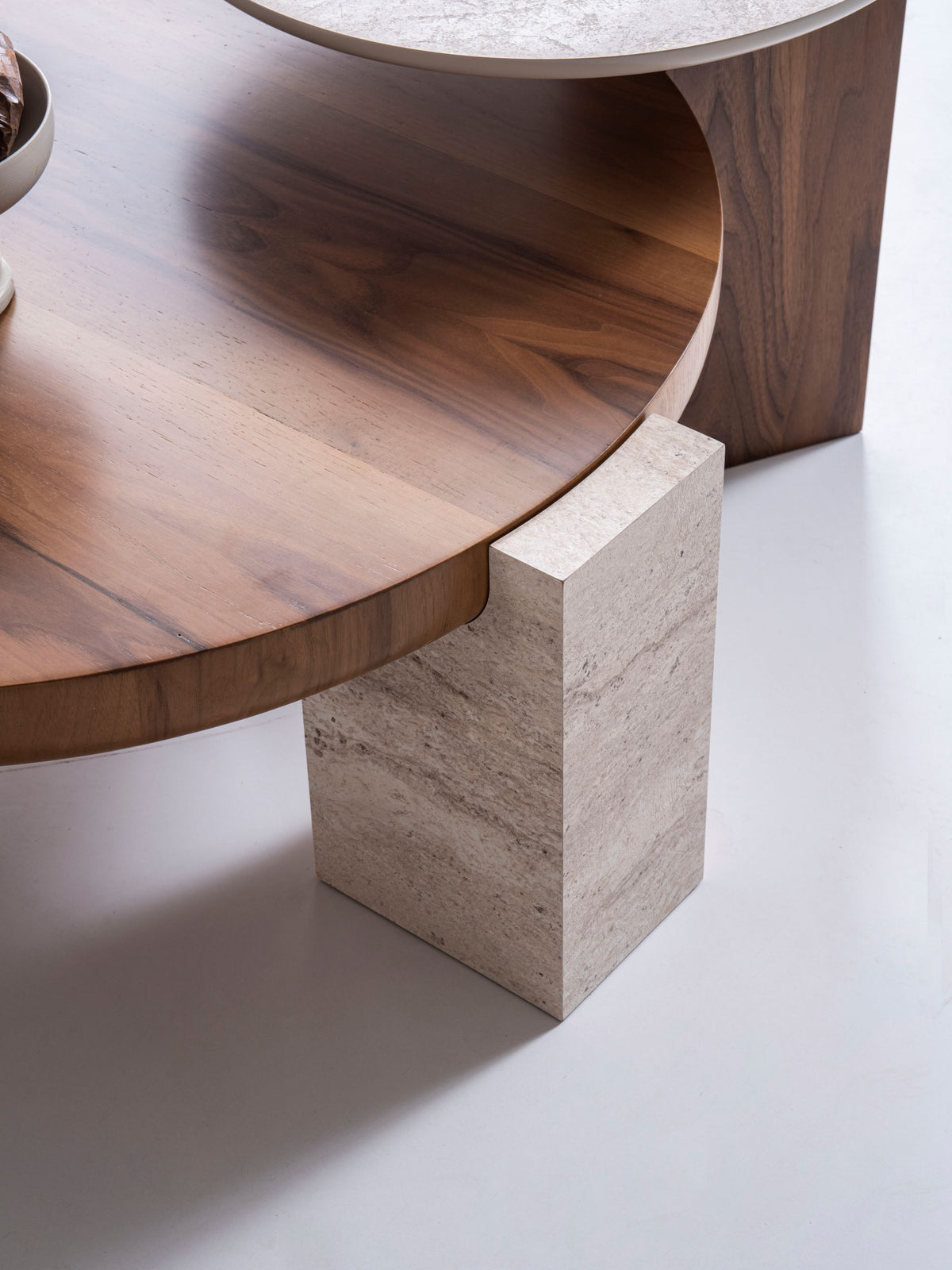 Close detail of travertine and walnut materials