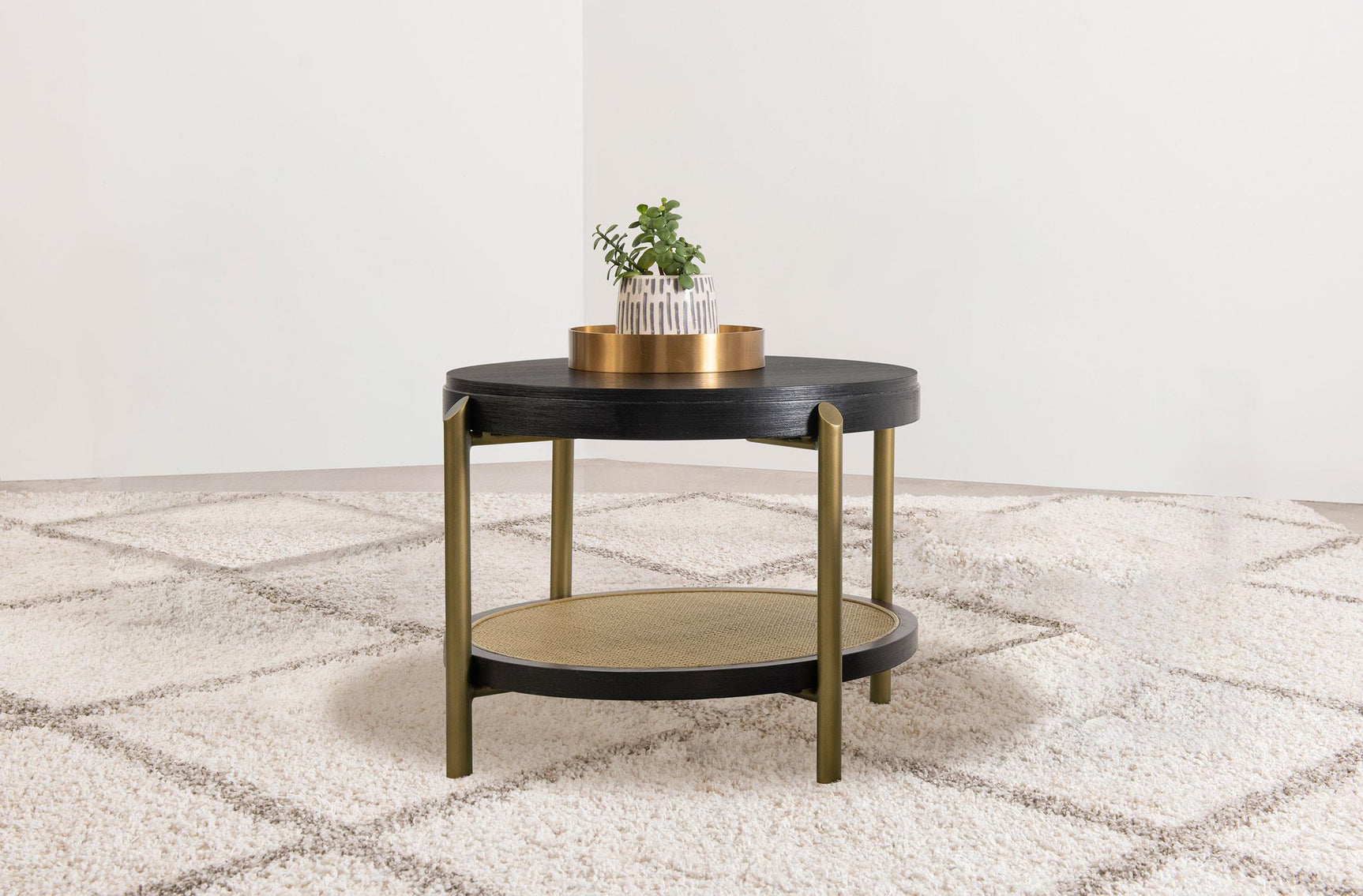 Side view of Arini round end side table with rattan lower shelf