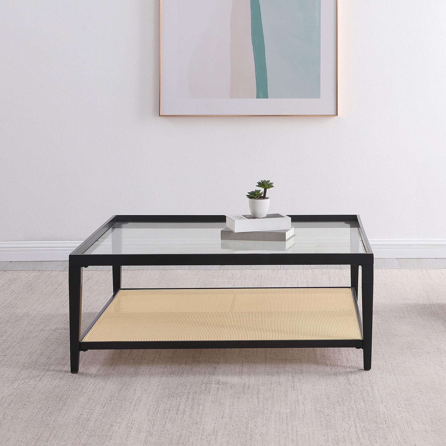 Amherst coffee table showing black metal frame and rattan shelf