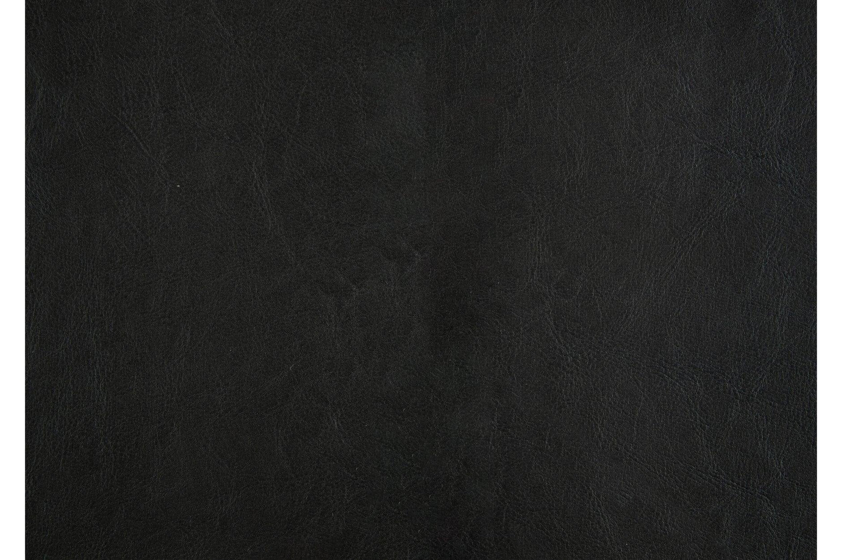 Side angle of dark brown faux leather chair