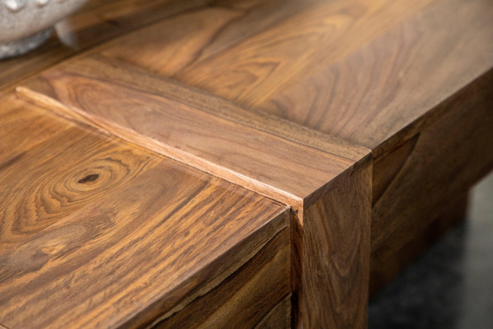 Skeet coffee table with natural finish in bright living room space
