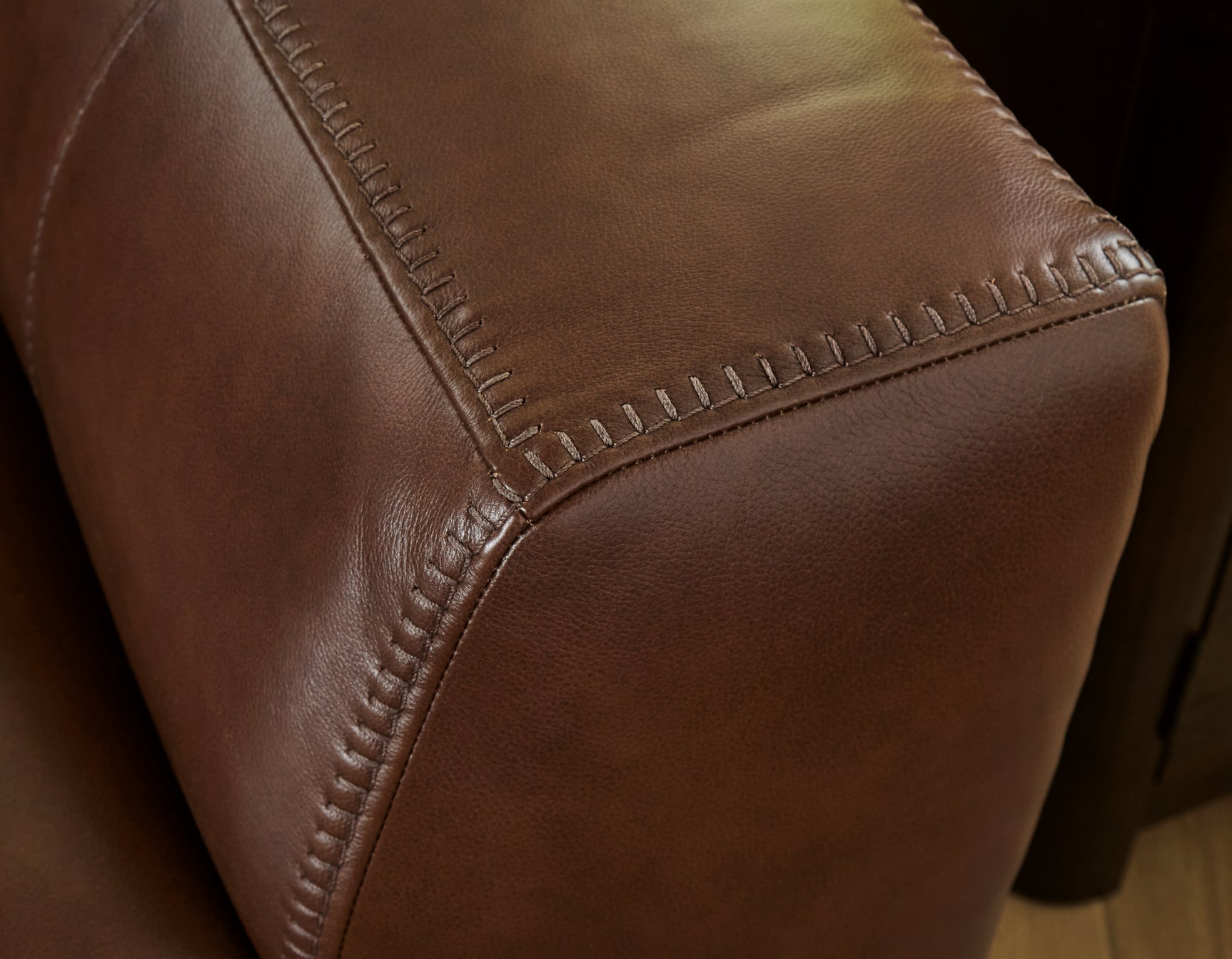Close-up of jumbo stitch detail on leather upholstery