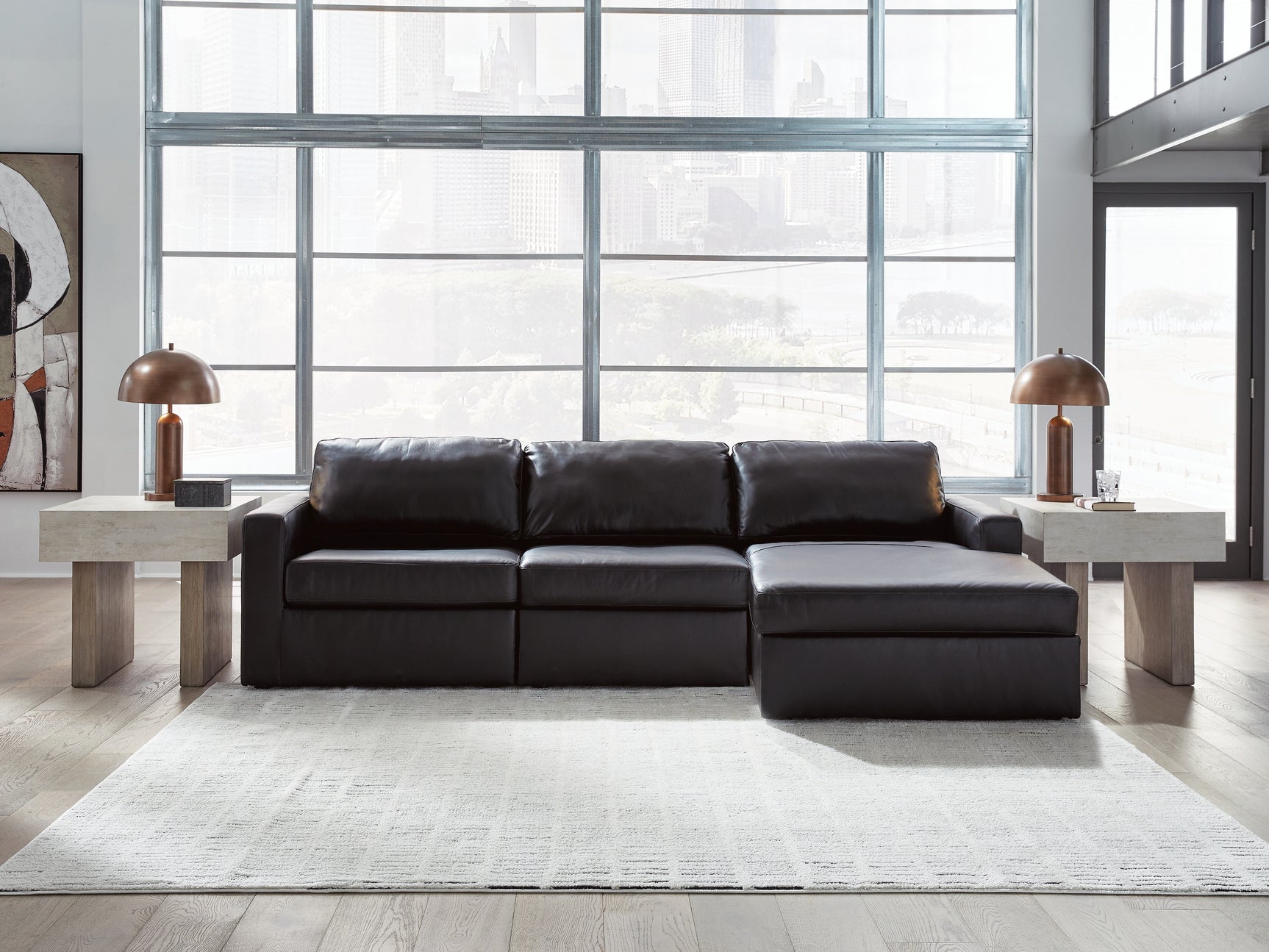Modmax II black leather 3-piece sectional sofa with chaise, side view