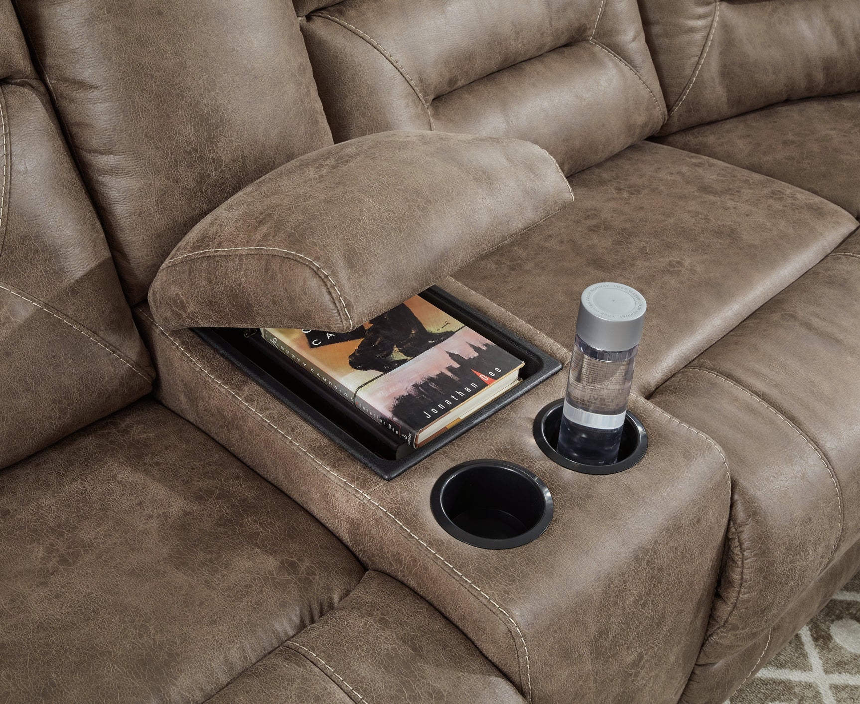 Center console detail with cup holders and storage