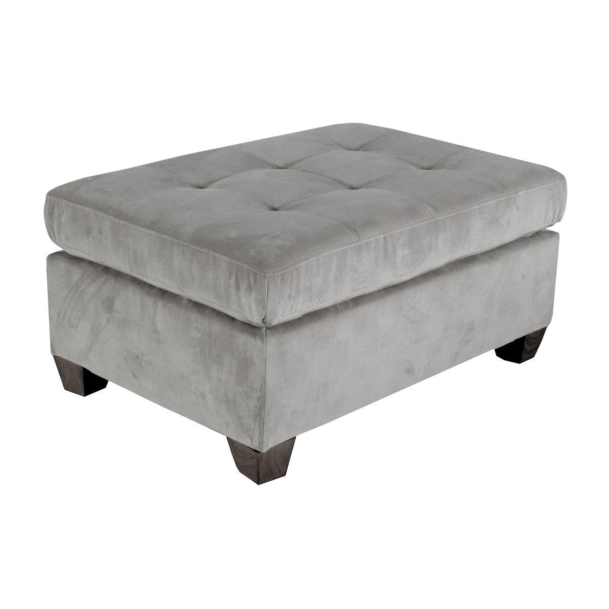 Side view of taupe microfiber tufted ottoman showing wood finish legs