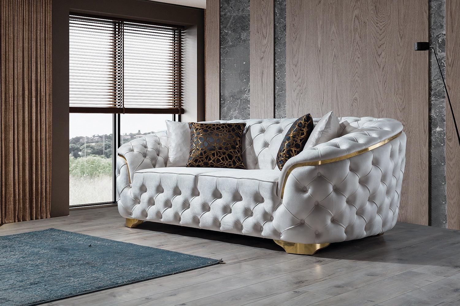 Side profile of loveseat highlighting its ivory velvet upholstery