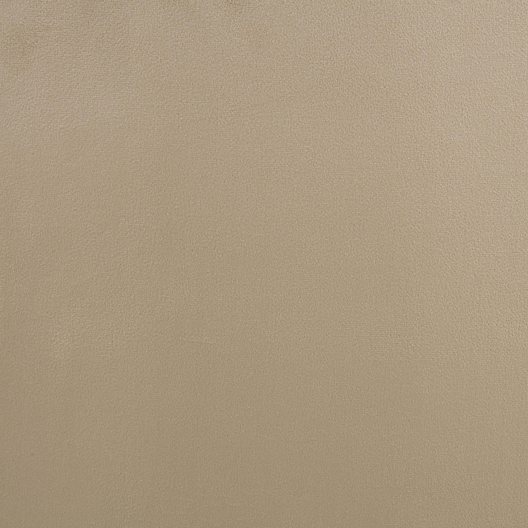 Close-up of camel velvet upholstery and black metal swivel base